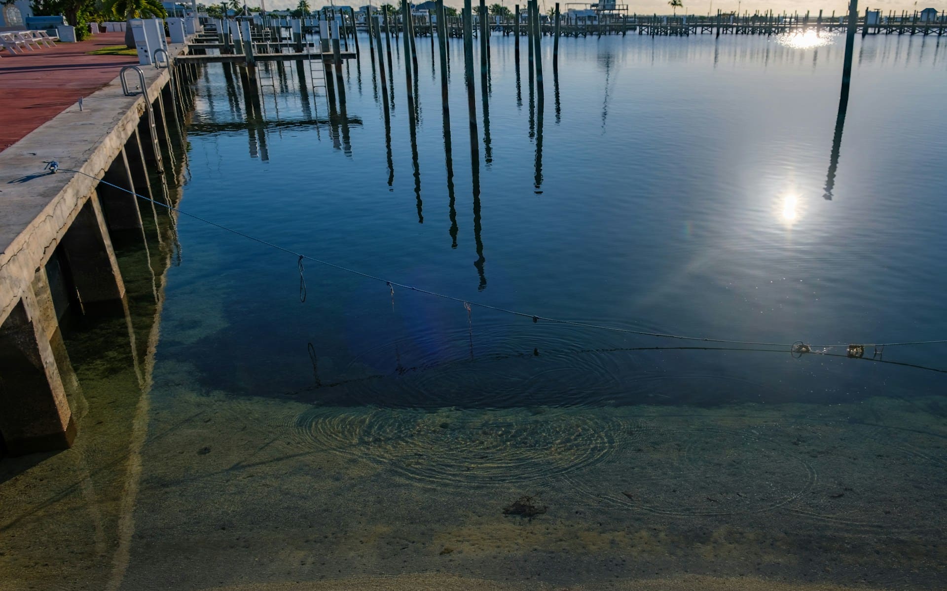 A dock and calm water on the Sea of Abaco