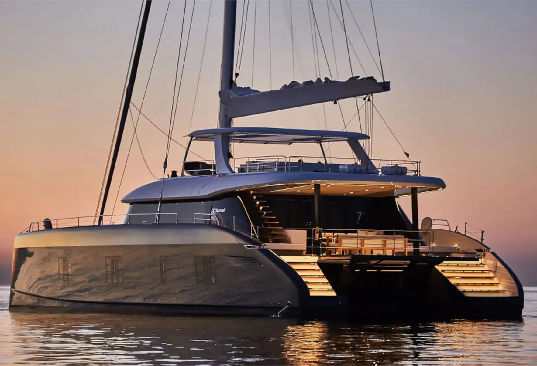 7X, a 24.4 m Sunreef sailing catamaran, at sunset with her stern steps lit